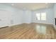 Large bonus room with hardwood floors and neutral colored walls at 2008 Plain Field Dr, Bessemer City, NC 28016