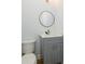 Powder room with a gray vanity and a round mirror at 2008 Plain Field Dr, Bessemer City, NC 28016