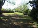 Expansive backyard featuring a storage shed and mature trees at 202 S Love Chapel Rd, Stanfield, NC 28163