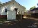 Rear view of home with new deck and shed, set in a tranquil backyard at 202 S Love Chapel Rd, Stanfield, NC 28163
