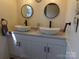 Stylish bathroom featuring double vessel sinks, modern faucets, and contemporary design elements at 202 S Love Chapel Rd, Stanfield, NC 28163