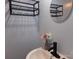 A charming bathroom corner with flowers, a mirror and a matte black faucet at 202 S Love Chapel Rd, Stanfield, NC 28163