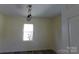 Bedroom with a modern light fixture and neutral walls at 202 S Love Chapel Rd, Stanfield, NC 28163