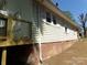 Side exterior view showing new wooden deck and well-maintained siding at 202 S Love Chapel Rd, Stanfield, NC 28163