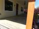 Inviting front porch with wooden deck and updated door at 202 S Love Chapel Rd, Stanfield, NC 28163