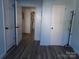 Hallway with updated flooring and classic white doors at 202 S Love Chapel Rd, Stanfield, NC 28163