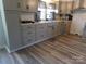 Modern kitchen featuring gray cabinetry, stainless steel appliances, and stylish black hardware at 202 S Love Chapel Rd, Stanfield, NC 28163