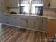 A charming kitchen with shaker cabinets, modern hardware, and natural light at 202 S Love Chapel Rd, Stanfield, NC 28163
