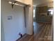 Convenient laundry area with washer/dryer hookups, open shelving, and easy access from the kitchen at 202 S Love Chapel Rd, Stanfield, NC 28163