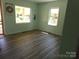 Bright room featuring two windows and updated flooring at 202 S Love Chapel Rd, Stanfield, NC 28163