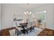 Elegant dining room with a modern chandelier, stylish furnishings, and view of the kitchen at 208 Grasshopper Cir, Mooresville, NC 28117