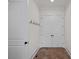 Hallway features coat hooks, tile flooring, neutral walls, baseboard and crown moulding and closet at 208 Grasshopper Cir, Mooresville, NC 28117
