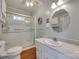 Bright bathroom featuring a large glass door shower and a sink with marble countertop at 220 Tomberlin Rd, Mount Holly, NC 28120