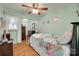 Bright bedroom with ceiling fan, light green paint, and ample furniture at 220 Tomberlin Rd, Mount Holly, NC 28120