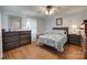 Charming bedroom with wood-look flooring and cottagecore-inspired decor at 220 Tomberlin Rd, Mount Holly, NC 28120
