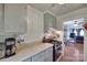 Traditional kitchen features appliances, light grey cabinets, and a view into the dining room at 220 Tomberlin Rd, Mount Holly, NC 28120