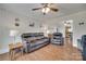 Spacious living room offering comfortable seating, hardwood floors, and an open layout connected to the kitchen at 220 Tomberlin Rd, Mount Holly, NC 28120