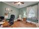 Home office featuring a dark wood desk, a black leather chair, and a window at 220 Tomberlin Rd, Mount Holly, NC 28120