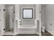 Modern bathroom featuring a separate shower, tub, and toilet with dark finishes at 2212 University Dr, Lancaster, SC 29720