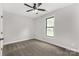 Bedroom showcases neutral walls, carpet flooring, window, and ceiling fan at 2212 University Dr, Lancaster, SC 29720