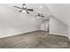 A large bonus room with carpet, two ceiling fans, and neutral colored walls at 2212 University Dr, Lancaster, SC 29720