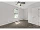 A bright bedroom features neutral walls, a window, and a ceiling fan at 2212 University Dr, Lancaster, SC 29720
