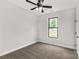 Bedroom showcasing neutral walls, carpet flooring, window, and ceiling fan at 2212 University Dr, Lancaster, SC 29720