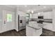 Charming kitchen features stainless steel appliances, granite countertops, and a functional island at 2212 University Dr, Lancaster, SC 29720