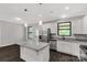 Charming kitchen features stainless steel appliances, granite countertops, and a functional island at 2212 University Dr, Lancaster, SC 29720