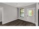 Bright room with a neutral color scheme with a window and an exterior door at 2212 University Dr, Lancaster, SC 29720