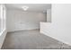 Large bonus room with neutral carpet, many windows, and lots of natural light at 24558 Blue Heron Cir # 402, Lancaster, SC 29720