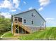 Exterior view of the home highlighting screened porch and yard at 24558 Blue Heron Cir # 402, Lancaster, SC 29720