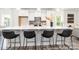 Modern kitchen with a large island, quartz countertops, stainless steel appliances, and stylish bar stools at 24558 Blue Heron Cir # 402, Lancaster, SC 29720
