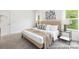 Well-lit main bedroom with neutral decor and comfortable furnishings at 24558 Blue Heron Cir # 402, Lancaster, SC 29720