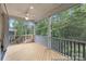 Comfortable screened porch with wood flooring and views of nature at 24558 Blue Heron Cir # 402, Lancaster, SC 29720