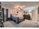 Spacious bedroom with carpeting, ample natural light, and stylish furniture at 308 Valhalla Dr, Harrisburg, NC 28075