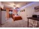 A charming bedroom with unique wall art, modern ceiling fan, and colorful decor at 308 Valhalla Dr, Harrisburg, NC 28075