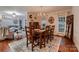 Cozy dining room adjacent to living room with hardwood floors and natural light at 308 Valhalla Dr, Harrisburg, NC 28075