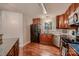 Traditional kitchen with wood cabinets, granite countertops, stainless steel appliances, and hardwood floors at 308 Valhalla Dr, Harrisburg, NC 28075