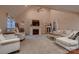 Bright living room with vaulted ceiling, fireplace, and neutral decor at 308 Valhalla Dr, Harrisburg, NC 28075