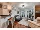 Cozy living room area with ample seating and a large window providing natural light at 308 Valhalla Dr, Harrisburg, NC 28075