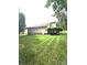 Spacious backyard featuring lush green grass, mature trees, and a tranquil setting at 317 Robert Keever Rd, Stanley, NC 28164