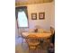 Bright breakfast nook featuring a round wooden table and natural light at 317 Robert Keever Rd, Stanley, NC 28164