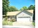 Charming ranch-style home with a two-car garage, lovely landscaping, and a welcoming curb appeal at 317 Robert Keever Rd, Stanley, NC 28164