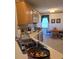 Functional kitchen with a breakfast bar and view into the dining area at 317 Robert Keever Rd, Stanley, NC 28164