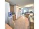 A kitchen featuring tile floors, wooden cabinets, and white appliances at 317 Robert Keever Rd, Stanley, NC 28164