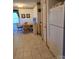 Cozy kitchen area with a dining table, white appliances, and tile flooring at 317 Robert Keever Rd, Stanley, NC 28164