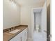 Elegant bathroom boasts a stone countertop, white vanity, and tile flooring for a sleek and modern appeal at 3308 Watkins Rd, Monroe, NC 28110