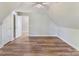 Charming bedroom featuring hardwood floors, ceiling fan, and closet space at 3308 Watkins Rd, Monroe, NC 28110
