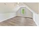 Cozy bedroom with vaulted ceiling and a window that provides light and nature views at 3308 Watkins Rd, Monroe, NC 28110